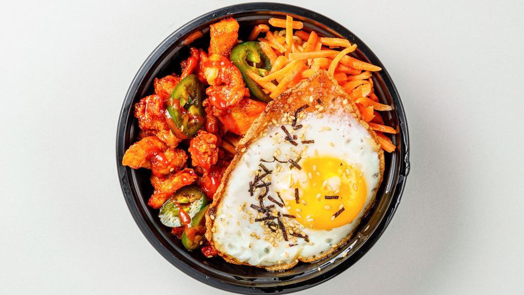 Hot Junt · Spicy. Spicy crispy fried chicken with ramen noodles in a spicy chili sauce topped with fresh cucumber, carrot and fried egg.