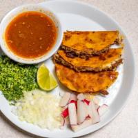 Quesabirria · Tree delicious birria and cheese tacos, with consome, (broth), radishes onions, cilantro and...