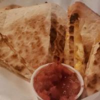 Chicken Quesadilla · Grilled tortillas filled with chicken and cheese. Served with sour cream and salsa.