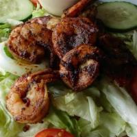 Blackened Shrimp Salad · Cajun style shrimp on crisp salad greens with tomato, cucumber, onion, and green pepper.