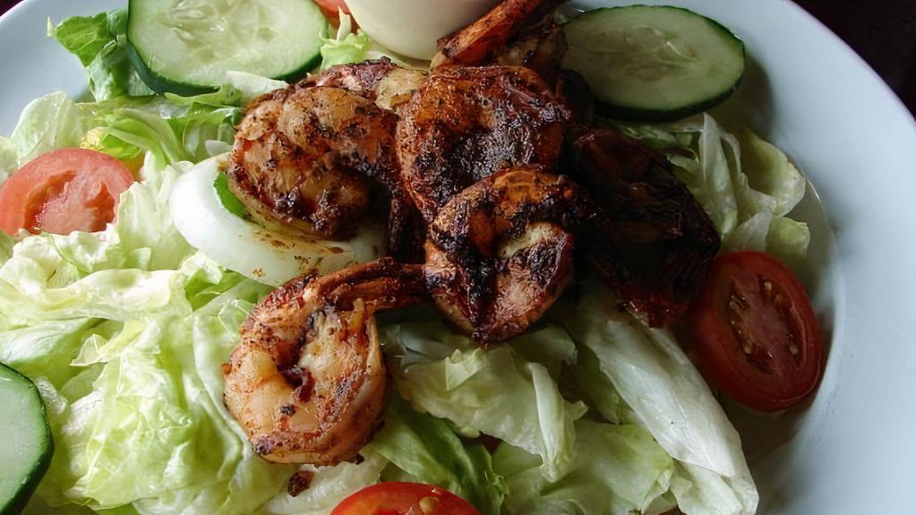 Blackened Shrimp Salad · Cajun style shrimp on crisp salad greens with tomato, cucumber, onion, and green pepper.