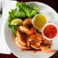 Shrimp Stir Fry · Blackened shrimp stir fried with rice and fresh vegetables.
