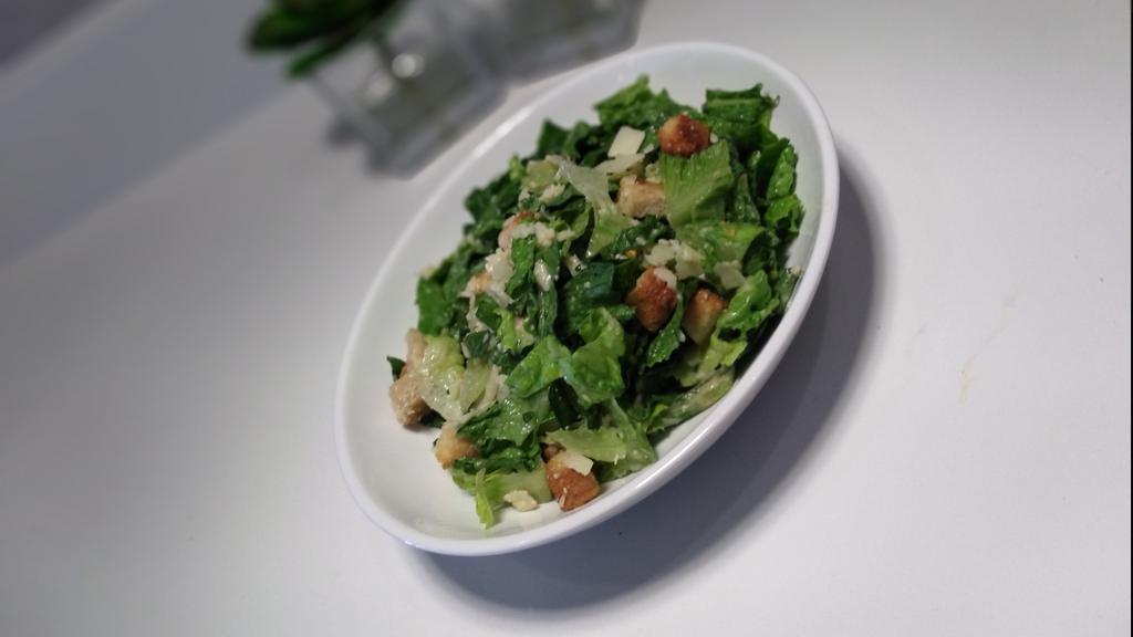 Cambria Caesar Salad · Romaine lettuce , shaved parmesan, home-style croutons served with Caesar dressing.