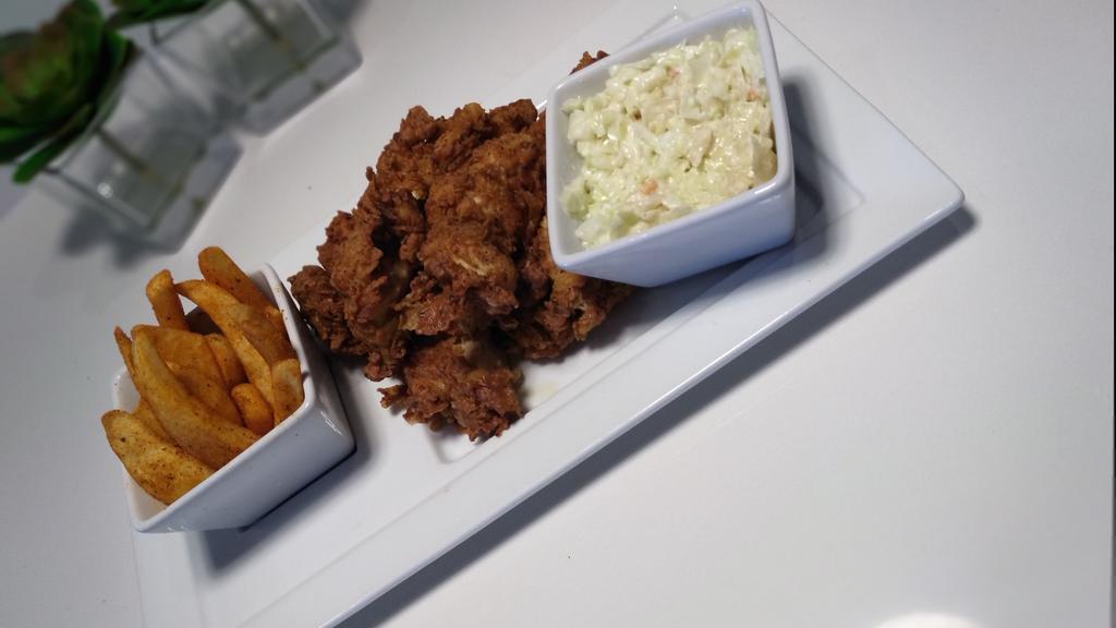 Chicken Tender Plate · Hand breaded chicken tenders with French fries and cole slaw.