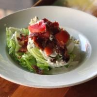 Wedge Salad · iceberg - crumbled blue cheese - diced bacon - tomatoes-