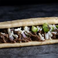 Philly Flatbread · Shredded beef, green peppers, red onions, mozzarella and CE Spicy Ranch