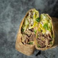 Grecian Wrap · Shredded beef, romaine, red onion, banana peppers, mozzarella and CE Grecian sauce in a whol...