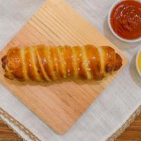 Pretzel Dog Combo · All beef hot dog wrapped in a hand-rolled pretzel with dipping sauce and a 16-ounce soda.