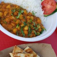 Chana Masala (Vegan) · Traditional chick peas dish cooked in gingered infused onion and tomato sauce.