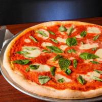 Cauliflower Margherita Pizza · Fresh mozzarella, Roma tomatoes, garlic, fresh basil & extra virgin olive oil.
