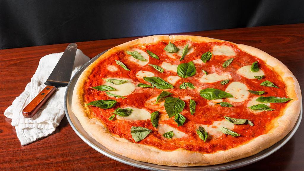 Cauliflower Margherita Pizza · Fresh mozzarella, Roma tomatoes, garlic, fresh basil & extra virgin olive oil.