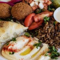 Falafel Platter · Four pieces with house salad, hummus, rice, and tahini.