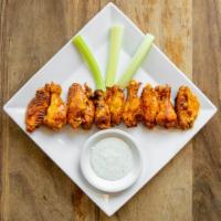 Chicken Wings (10) · Oven baked then fried chicken wings, covered in buffalo sauce. Served with celery and ranch ...