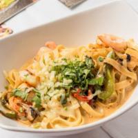 Chipotle & Shrimp Pasta · New. Delicious pan sautéed pasta with shrimp onions and peppers in a chipotle and roasted co...