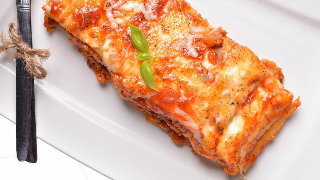 Lasagna Classico · Beef, tomato, mozzarella over layers of tender pasta, topped with marinara sauce and baked with cheese.