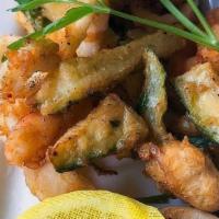 Fritto Misto · Deep-fried calamari, shrimp and seasoned vegetables served with a light spicy tomato sauce. ...