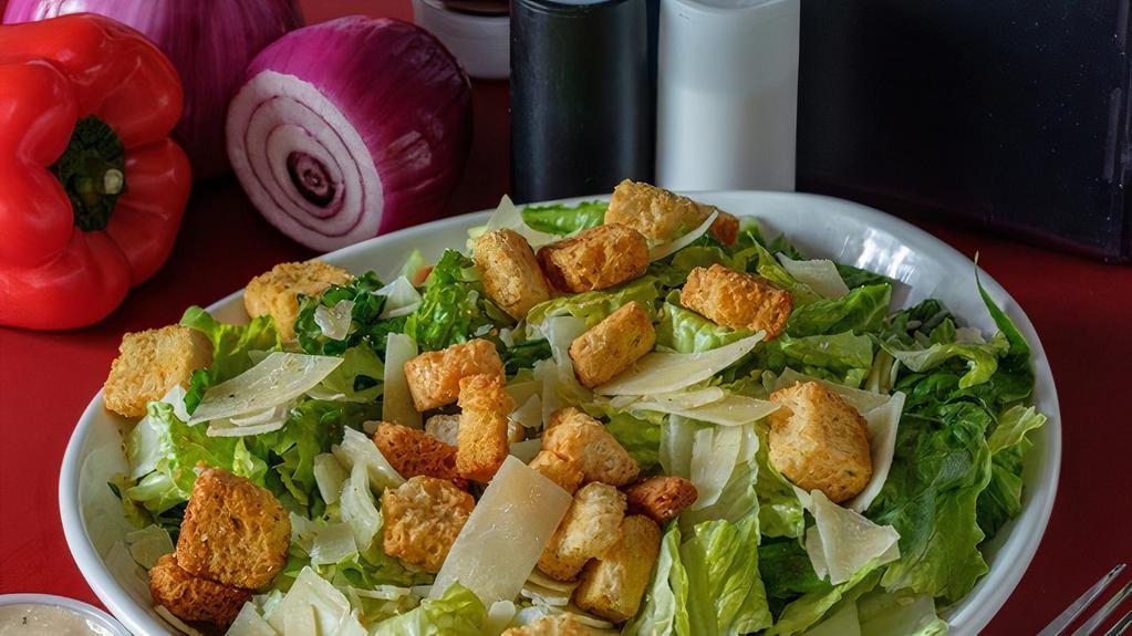 Caesar Salad · Romaine Lettuce, Parmesan Cheese, Croutons And Caesar Dressing