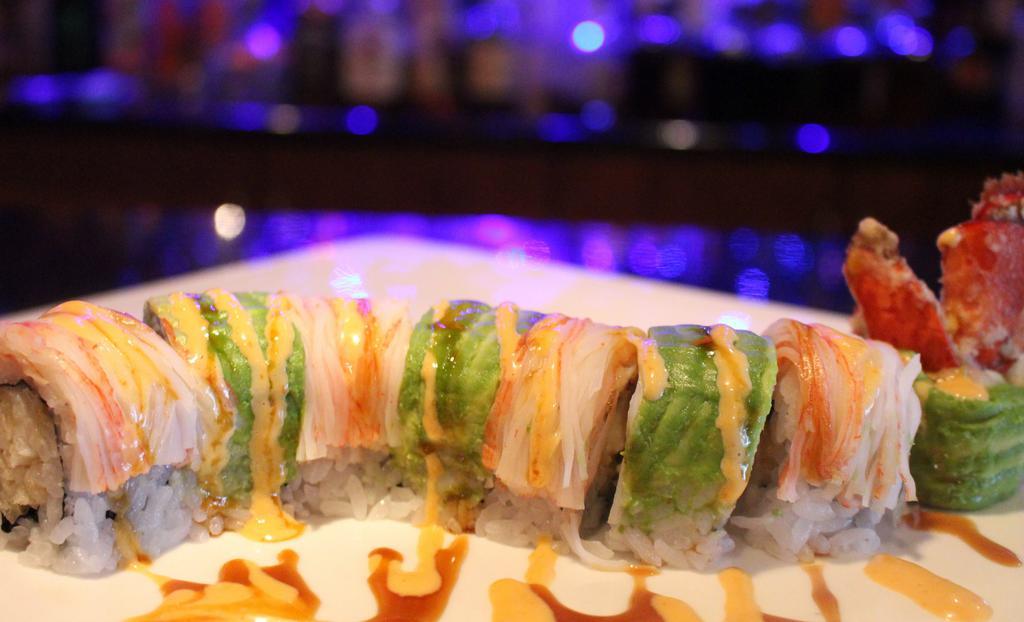 Lobster King Roll · Lobster tempura topped with crabstick and avocado, garnished with spicy mayo and eel sauce.