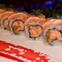 Cordova Roll · Salmon tempura and avocado, topped with seared salmon, garnished with green onions.