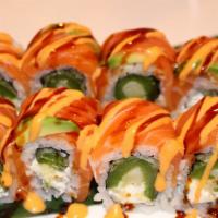 *Chili Roll · Fried jalapeno, green onions and cream cheese inside, salmon on the top, garnished with spic...