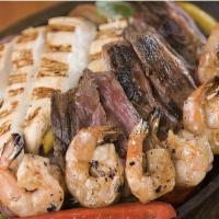 Fajitas · Your choice of protein, sizzling with onions, tomatoes & bell peppers with lettuce, tomato, ...