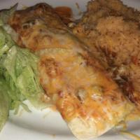 Burrito Supreme · Flour tortilla rolled around beef, beans & cheese topped with lettuce, tomatoes & guacamole;...