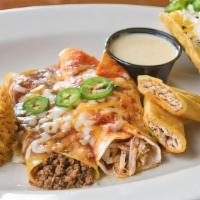Enchilada Burrito Dinner · One burrito topped with enchilada sauce; served with rice & refried beans.
