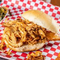 Pulled Chicken Bbq · Sandwich with one side and hushpuppies.