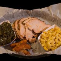 Turkey Breast · Plate with two sides and hushpuppies.