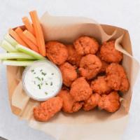 15 Crispy Boneless Wings · 15 Crispy boneless chicken wings tossed with up to 2 wing flavors and served with fresh carr...