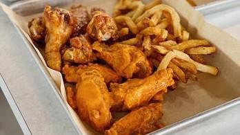 10 Classic Bone-In Wings Combo · 10 Classic bone-in chicken wings tossed with up to 2 wing flavors and served with fresh carr...