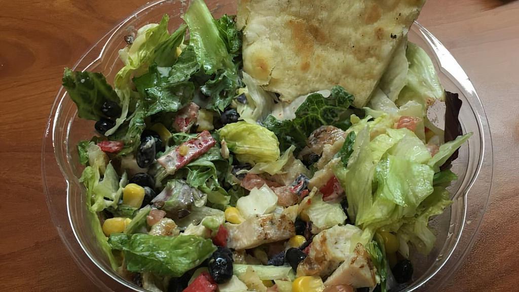 Sante Fe · Romaine, grilled chicken, black beans, corn, tomatoes, avocado, and tortilla strips.