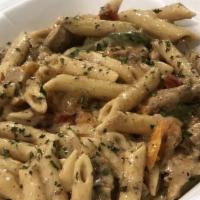 Grilled Jerk Chicken Rasta Pasta · This pasta is perfect for the night that you're craving a little bit of everything. It's spi...