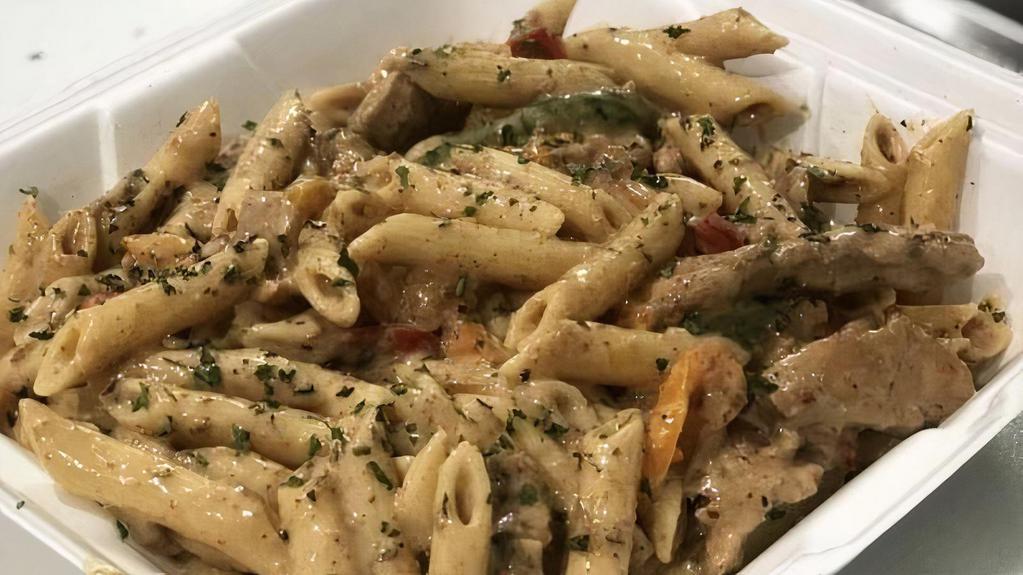 Grilled Jerk Chicken Rasta Pasta · This pasta is perfect for the night that you're craving a little bit of everything. It's spicy, it's creamy, there's veggies, there's lots of chicken, there's CHEESE... there's basically no flavor or texture that this dish doesn't have.