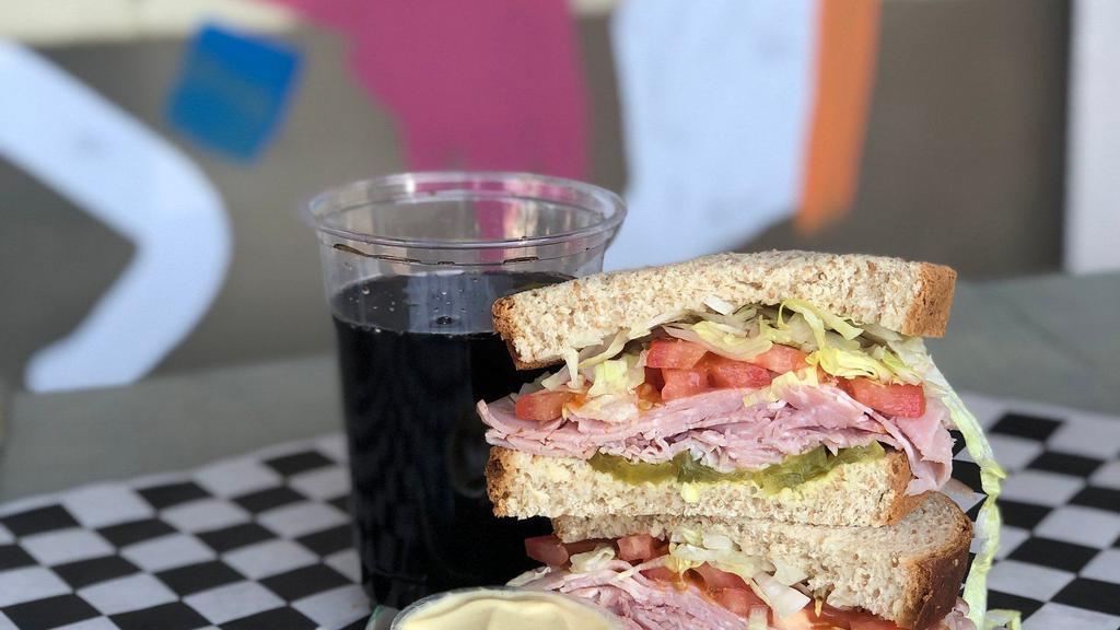 Dad'S Sandwich Meal · Dads will eat anything. Pit smoked ham and swiss cheese with dill pickles and lettuce. Dijon mustard on the side.

Choose a side and a drink.