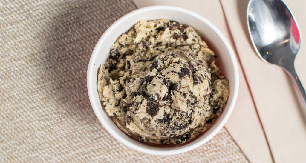 Cookies N' Cream · ﻿Made with whole Oreo's, our Cookies N' Cream Cookie Dough is the perfect balance of cookies and dough! This flavor is vegan.

This is dough you can eat raw. Or if you're crazy enough to try it, you can bake it too!

We make all of our dough without any eggs and we use heat treated flour. Making it safe to eat from the minute you open it to the second it's gone.

To bake our dough: heat your oven to 350 degrees, bake for 10-12 minutes, and then enjoy some doughlicious cookies! 

Our dough is kept refrigerated but you can also freeze it if you want (some people prefer to eat it frozen)!

No you don't have to eat it all at once (although you might want to). If you have leftovers after opening those are good for 4 weeks in your refrigerator and 3 months in your freezer.