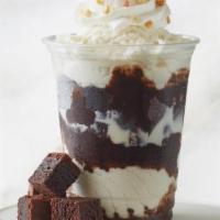 Brownie Sundae Delight · Fudge Brownie topped with vanilla ice cream, hot fudge, whipped topping, peanuts, and cherry.