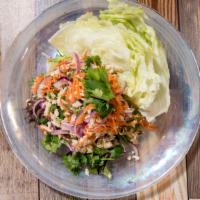Larb Gai (Minced Chicken Salad) · Minced chicken tossed with red onions and scallions in spicy lime dressing.