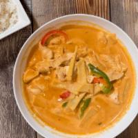 Red Curry · Simmered in a traditional coconut curry with bamboo shoot, green peppers.