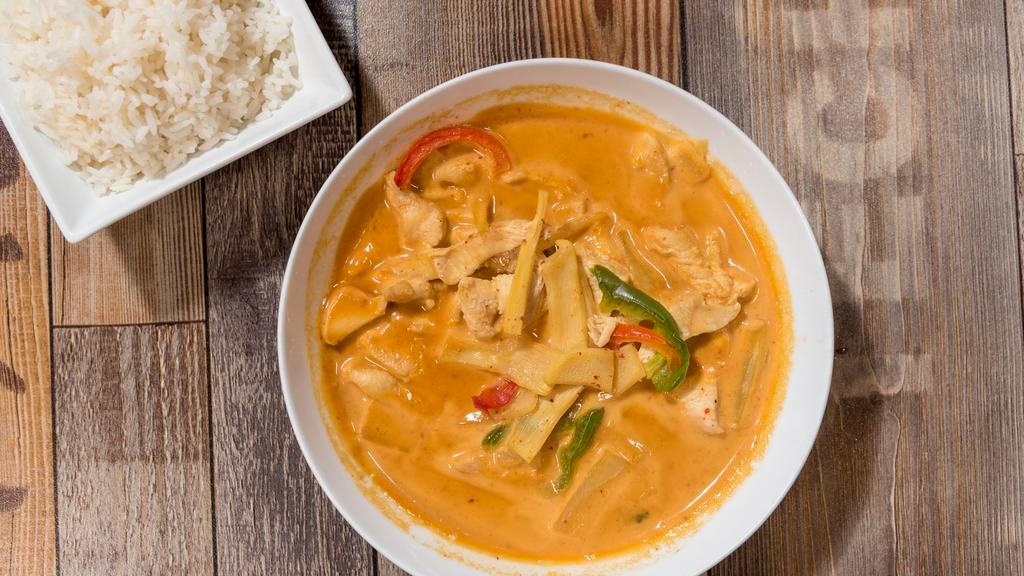 Red Curry · Simmered in a traditional coconut curry with bamboo shoot, green peppers.