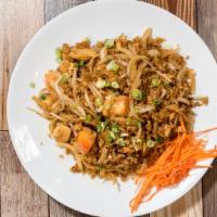Kao Pad · Stir-fried with rice, egg, tomatoes, bean sprouts, and topped with cucumber, carrots, green ...