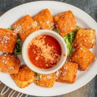 Toasted Ravioli · Stuffed with mozzarella topped with parmesan served with our homemade marinara.