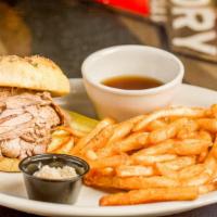 Beef On Weck · A buffalo, New York favorite. Slow cooked and sliced beef round on a weck roll topped with c...