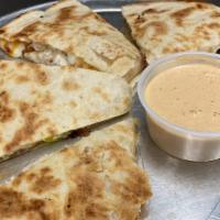 Chicken Quesadilla · Mixed cheeses with roasted chicken, bell pepper, red onion and roma tomato, served with Sout...