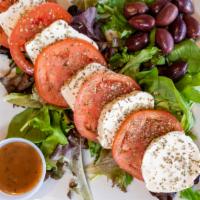 Caprese Salad · Fresh mozzarella cheese and tomatoes, garnished with Takis' special blend of Mediterranean s...