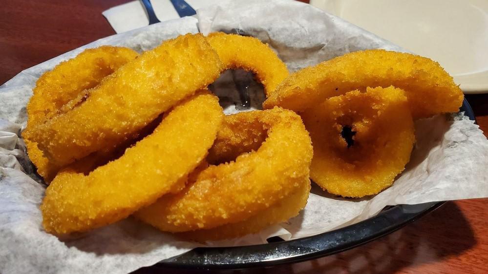 Onion Rings · Sliced onions dipped in seasoned flour and lightly fried.
