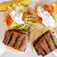 Gyro Sandwich · Tender juicy slices of gyros meat in hot pita bread with tomatoes, lettuce, onions, tzatziki...