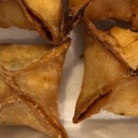 Crab Rangoon · Crab and cream cheese wrapped in wonton skin and deep fried.