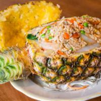 Pineapple Boat Fried Rice · Eggs, carrots, peas, raisins, onions, cashews and broccoli in fresh pineapple.