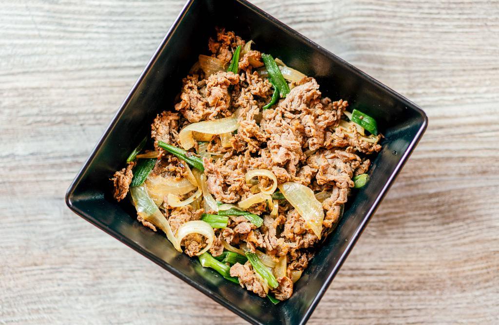 Beef Bulgogi Box · Thinly sliced grilled beef with Korean BBQ marinade and sautéed onions and scallions on top of white rice.